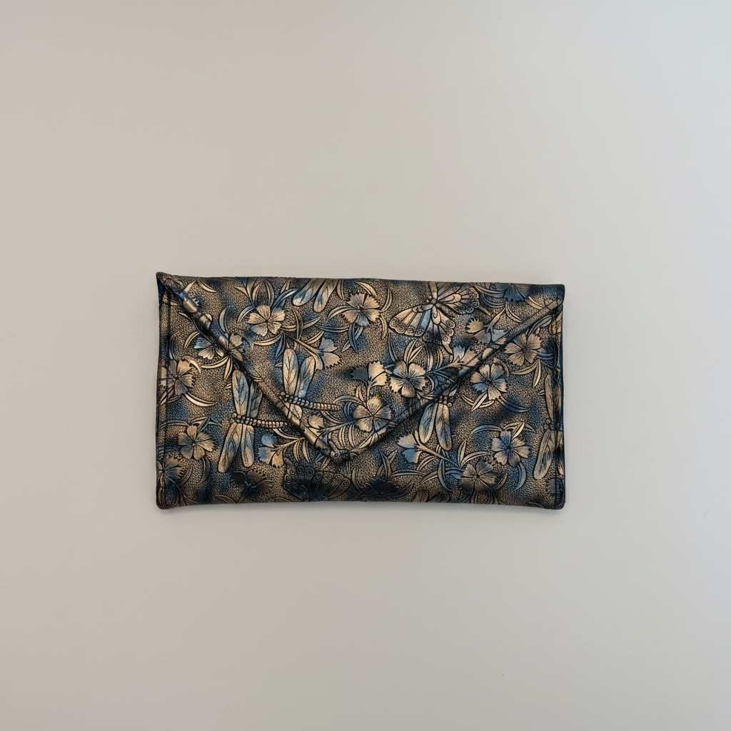 Floral patterned clutch bag on a textured surface