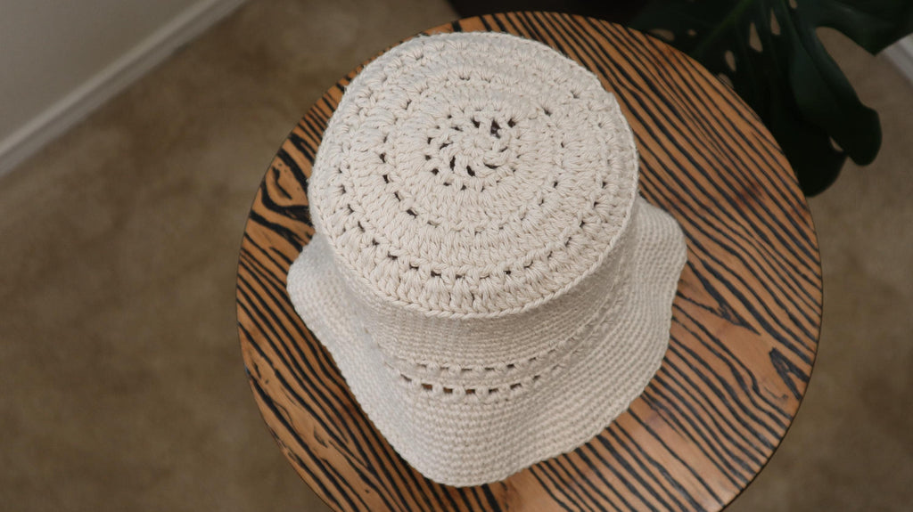 top-down view of starburst crochet cotton bucket hat for summer