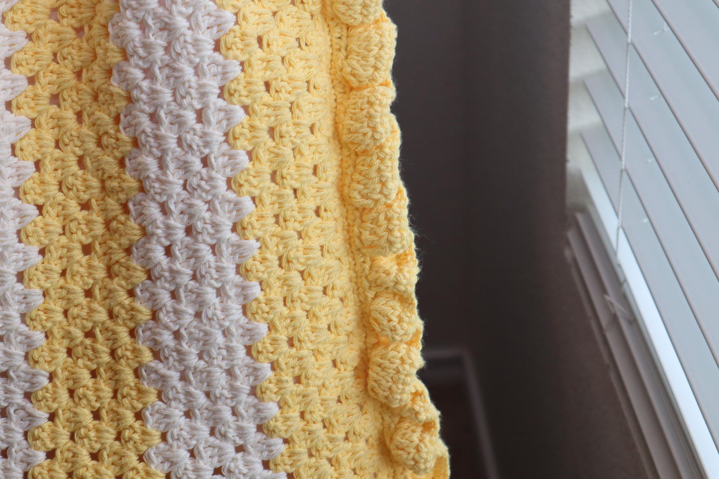 A close picture of ruffled edges and granny stitch